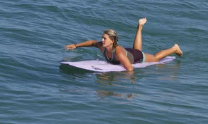 Candid surfer babes on the beach and in bikinis