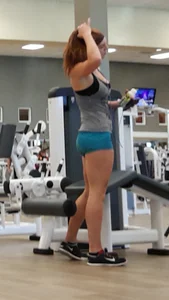 Redhead in teal spandex shorts