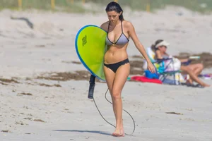 Candid girls surfing on the beach