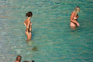 FKK Nudists playing in the water with floater