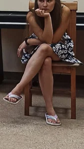 Girl in a Dress And Slippers Sitting on Chair With Crossed Legs Creepshot