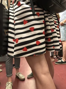 Girl in Striped Dress with Hearts Pattern Skinny Legs Subway Closeup Creepshot
