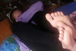 Young Girl's Bare Feet Selfies in Bed