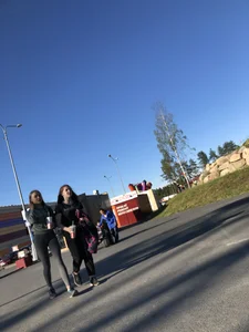 Skinny Girl in Grey Leggings Walking Past the Camera Candid Photos Gallery