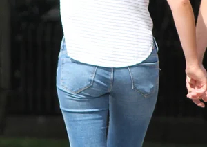 Blonde chick walking with her boyfriend in tight jeans