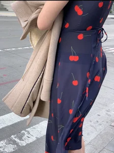 Business women with a visible thong in a see through Cherry Dress