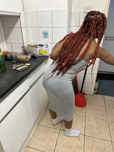 Very cute girl wearing a long tight grey dress kitchen creepshots