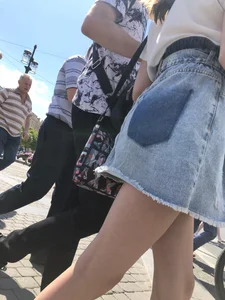 Teen Candid Girl in a Denim Skirt And Sneakers With Thin Legs on a Crosswalk Creepshots