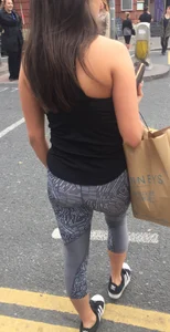 Sexy girl walking in grey patterned leggings with friend in tight jeans