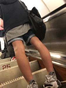Girl in Boyish Clothes with Skinny Legs Subway Escalator Candid