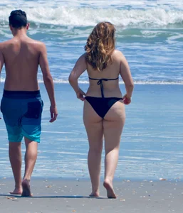 Chubby white girls in bikinis on the beach