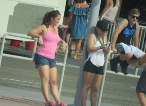 Couple of babes standing around in shorts