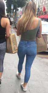 Sexy girl walking in grey patterned leggings with friend in tight jeans