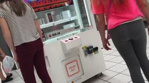 Little blonde teen in grey leggings at the mall with her friends