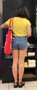 Store Creepshot of a Girl in Blue Denim Shorts with Cute Legs