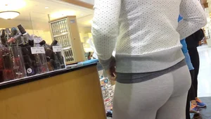 Cute blonde with great ass in tight grey leggings
