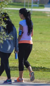 Thick lady walking in leggings with a big booty