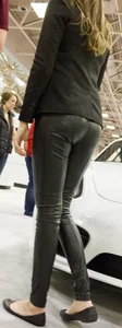 Pretty car saleswoman in tight shiny black pants with nice ass