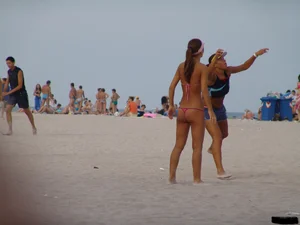 A bunch of sexy beach voyeur babes in bikinis, thongs and topless