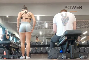 Gym brunette in tight grey shorts bending over, part 3