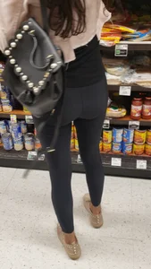 Cute butt in shiny black leggings