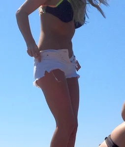 Two sexy blondes laying out in bikinis with nice bodies