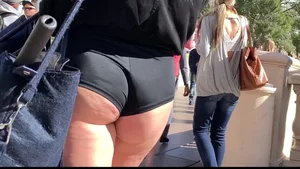 Hottie in spandex booty shorts with a nice ass showing her cheeks and slight camel toe