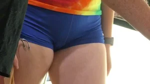 Girl in Spandex Mini Shorts and a Colorful T-Shirt at the Store Candid Photos