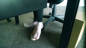 Female Bare Feet Under Table Closeup at the Office Creepshot