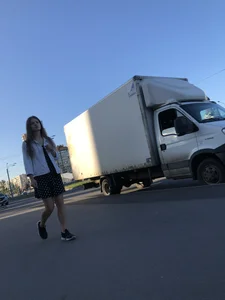 Extremely Cute Girl in a Skirt With a Backpack Passing By on the Street Gallery