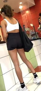 hot petite Indian chick showing some T&A in skimpy workout clothes