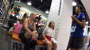 Red short shorts teen cheeks out. walking in mall