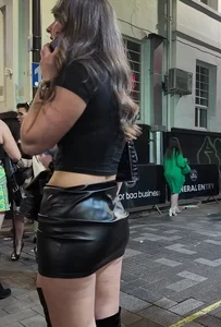 Very pretty girl in short leather skirt and high boots (not OC)