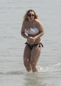 Big boobed thick blonde on the beach in a bikini