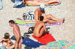 Ula FKK Sexy brunette on a nude beach topless, bottomless and with blue thong