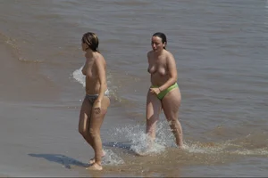 Girls on a nude beach in Sitges, Spain