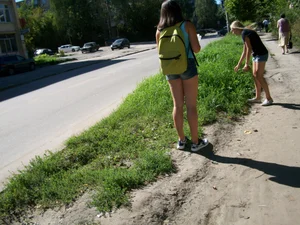 Chubby Teen with Her Thin Friend in Jeans Shorts on the Suburb Street