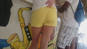 Milf in yellow shorts with vpl and a wedgie