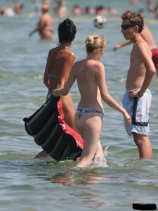 A bunch of sexy beach voyeur babes in bikinis, thongs and topless