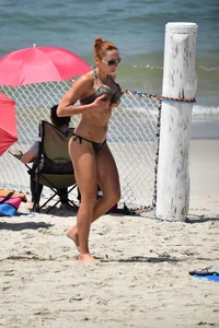 Redhead with nice tits in a bikini on the beach