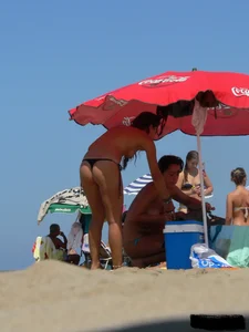 2 topless thonged sexy friends on the beach with great bodies