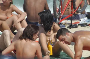Topless girls on a beach in Barcelona