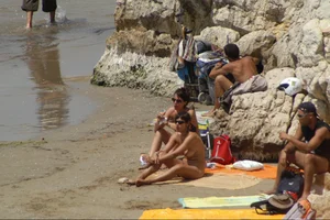 Girls on a nude beach in Sitges, Spain