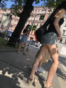 Candid girl in denim fringed shorts waiting on crosswalk, hot long and slim legs creepshots