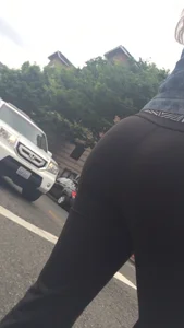 Girl with a nice ass in leggings walking down the street