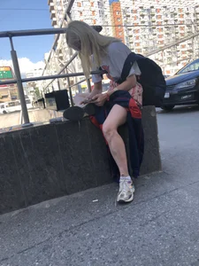 Blonde Girl Busy with Her Smartphone on the Street Candid Gallery