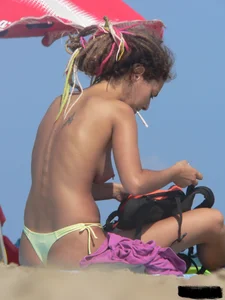 Sexy girls going topless at the beach showing off their sexy bodies