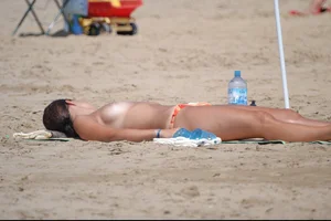 Girls on a nude beach in Bibione, Italy