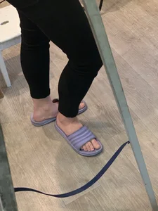 Teen Girl's Legs in Black Pants And Bare Feet in Slippers Home Creepshot