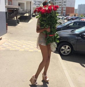 Long Legs on Heels Street Candid - Girl with a Bouquet